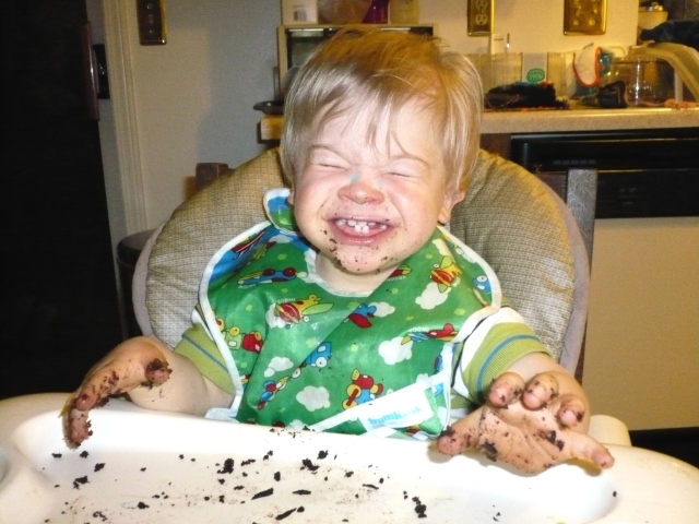 Raphael with a face full of cake on his second birthday