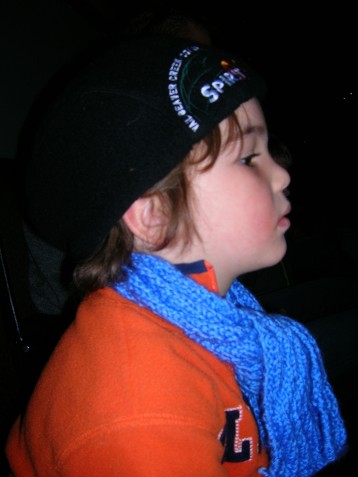Elijah in profile, engrossed in his first show: Toy Story on Ice.